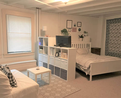 Cozy interior living space with bed and sofa
