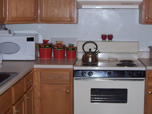 Well-appointed kitchen with utensils and decor.