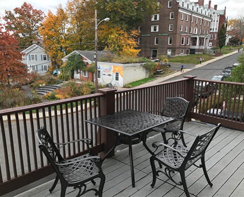 Outdoor seating area with fall foliage