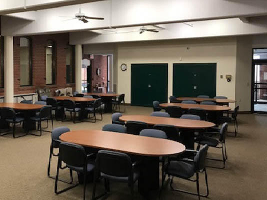 Interior view of a common area with tables and chairs