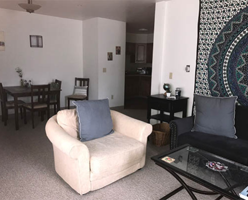 Cozy common area with seating and dining table.
