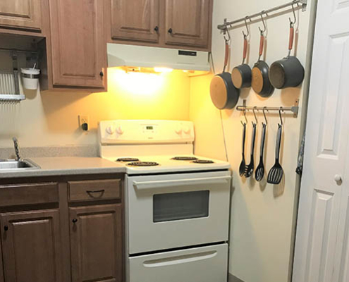 Well-equipped kitchen in assisted living facility.