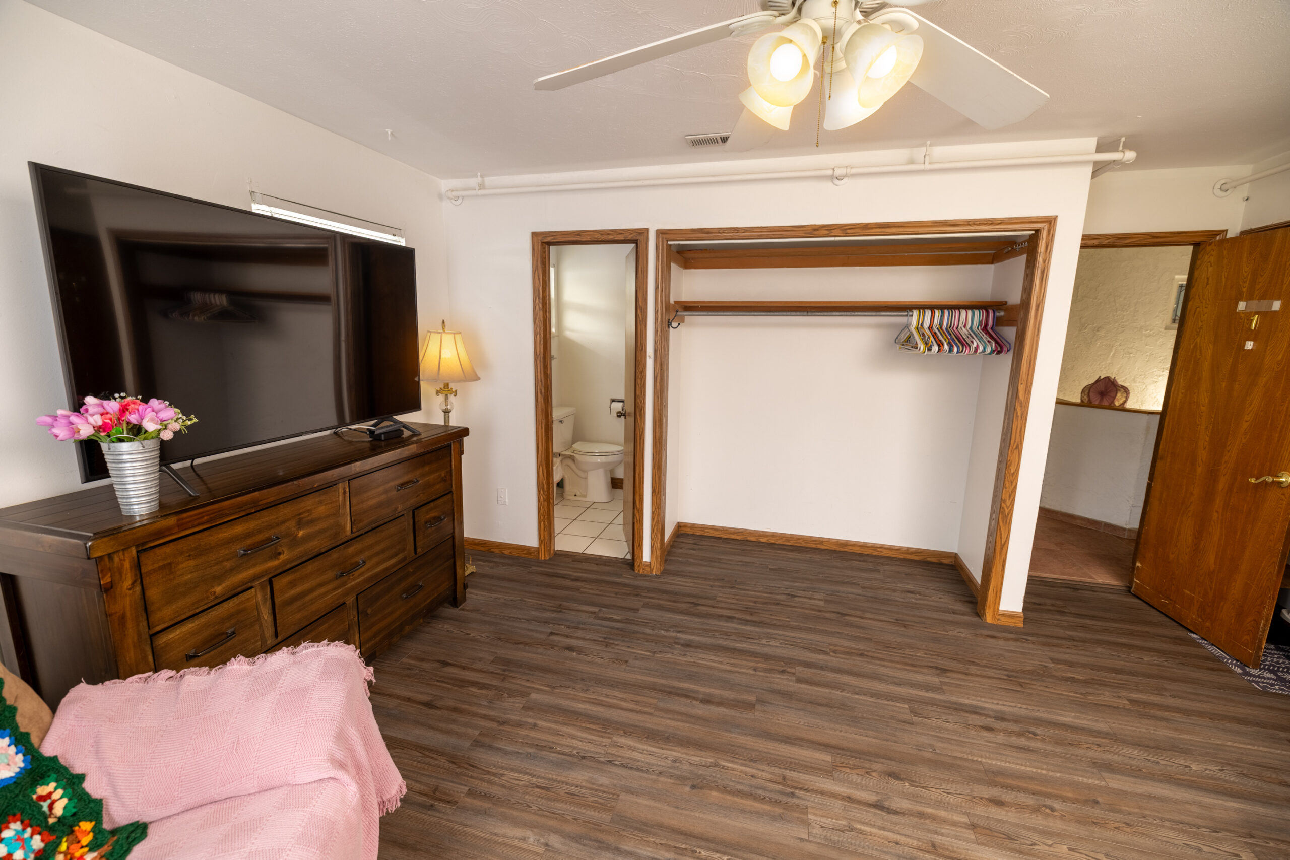 Private resident room with furniture and closet space.