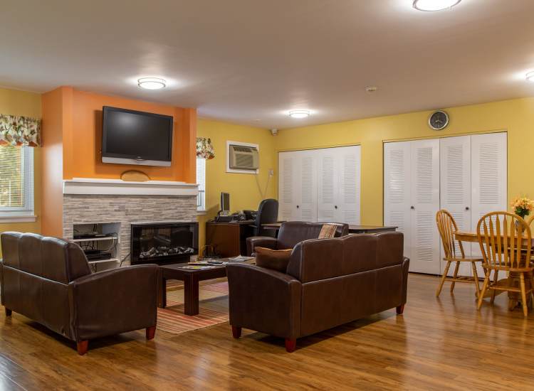 Cozy common area with seating and fireplace