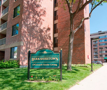 Exterior view of a senior living facility sign.