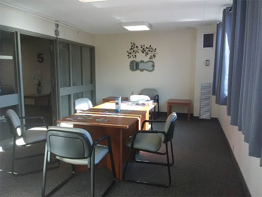 Empty meeting room with a table and chairs