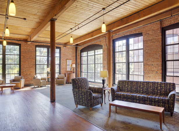 Cozy common area with seating and natural light.