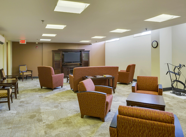 Common area with seating and television.