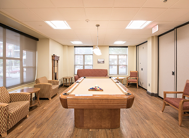 Common area with a pool table and seating
