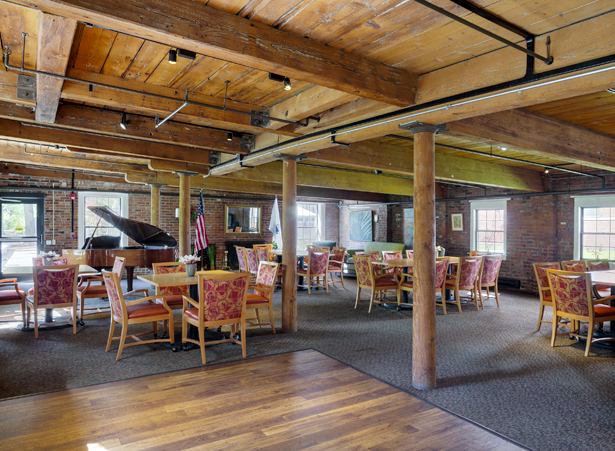 Dining area with wooden beams and chairs