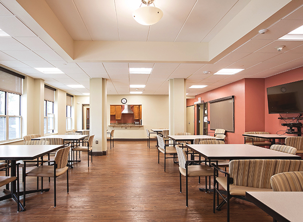 Bright dining area with tables and seating.