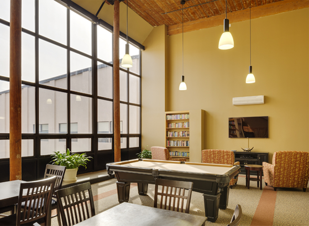 Interior common area with seating and pool table.