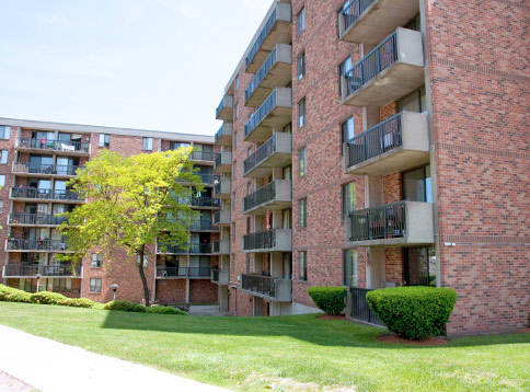 Building exterior with balconies and landscaping.