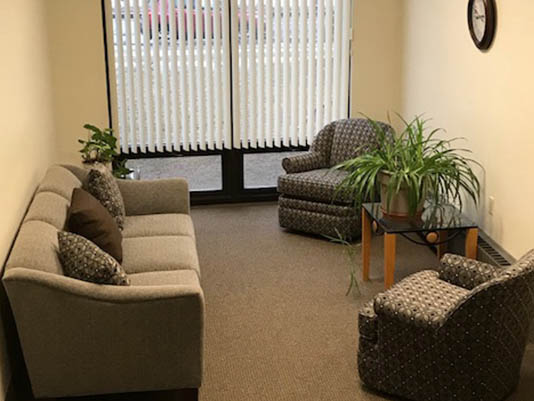 Cozy common area with seating and plants