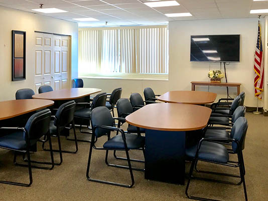 Interior meeting room with tables and chairs