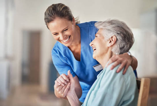 Staff member laughing with resident