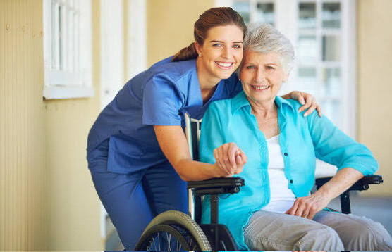 Staff member with a resident in a wheelchair