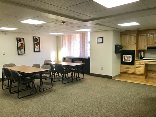 Interior common area with dining setup.