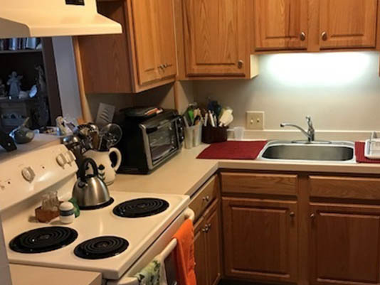 A well-organized kitchen with wooden cabinets