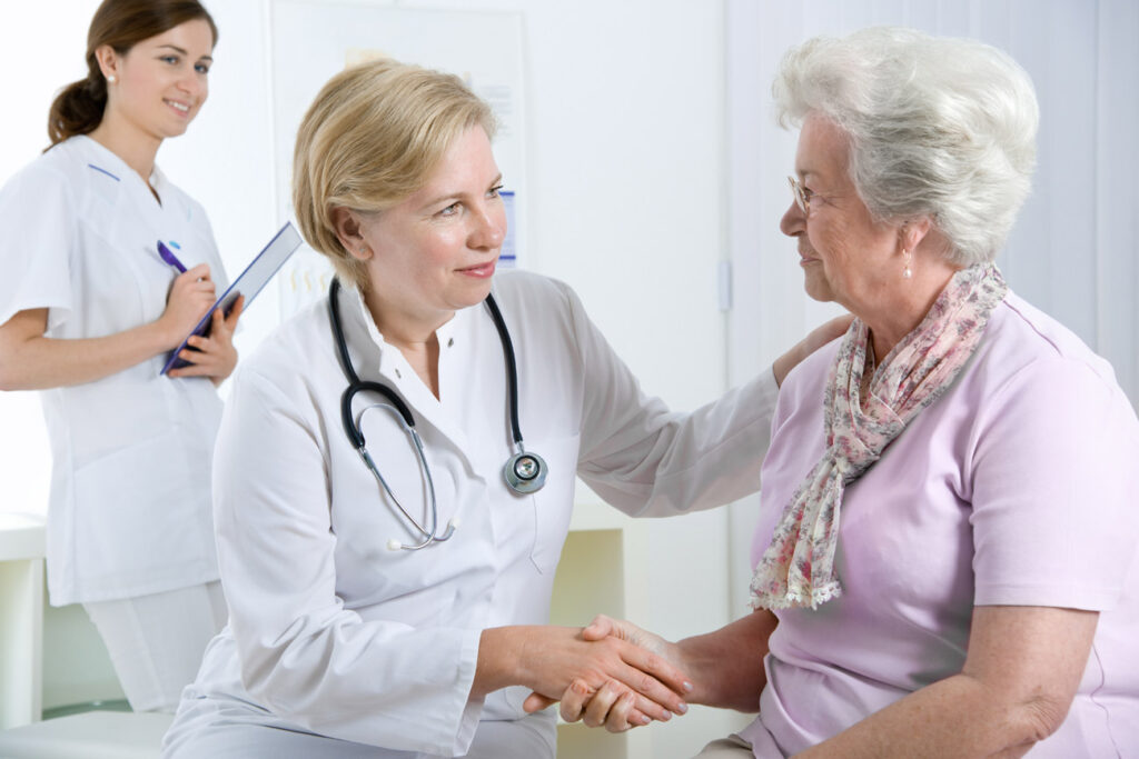 Doctor interacting with elderly patient