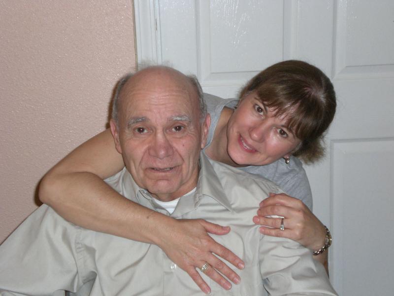 A caregiver and senior resident sharing a moment.