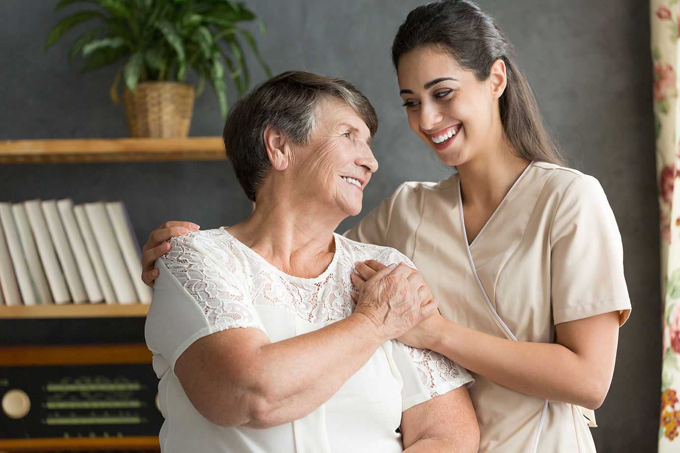 Staff member smiling with a resident