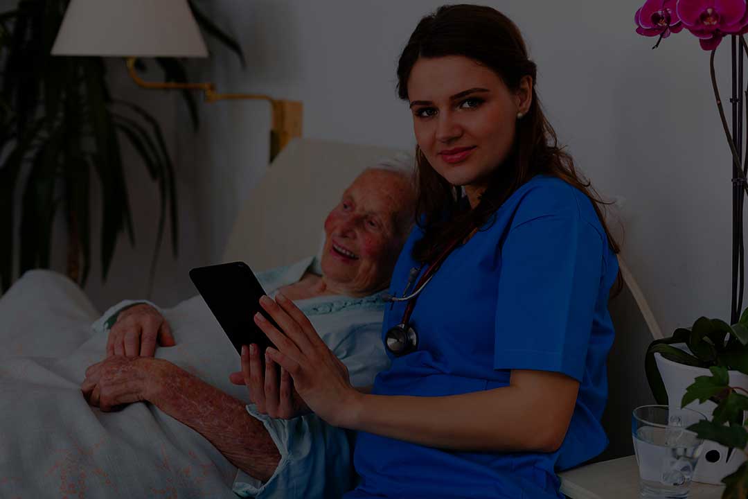 Nurse assisting elderly resident in a care facility