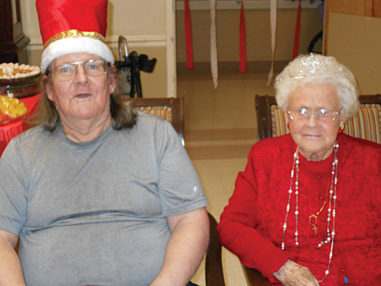 Two residents wearing holiday attire.