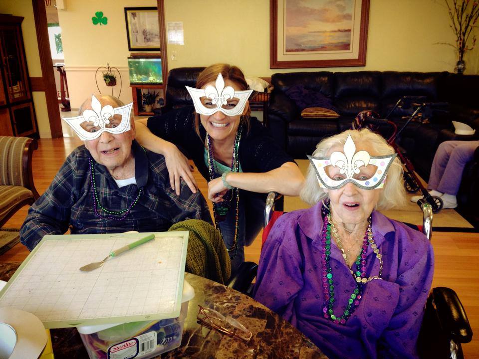 Residents and staff celebrating with festive glasses.