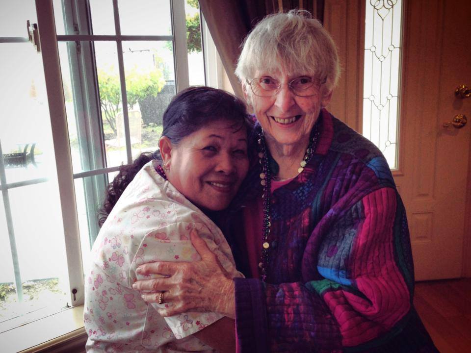 Two residents enjoying a joyful moment together indoors.
