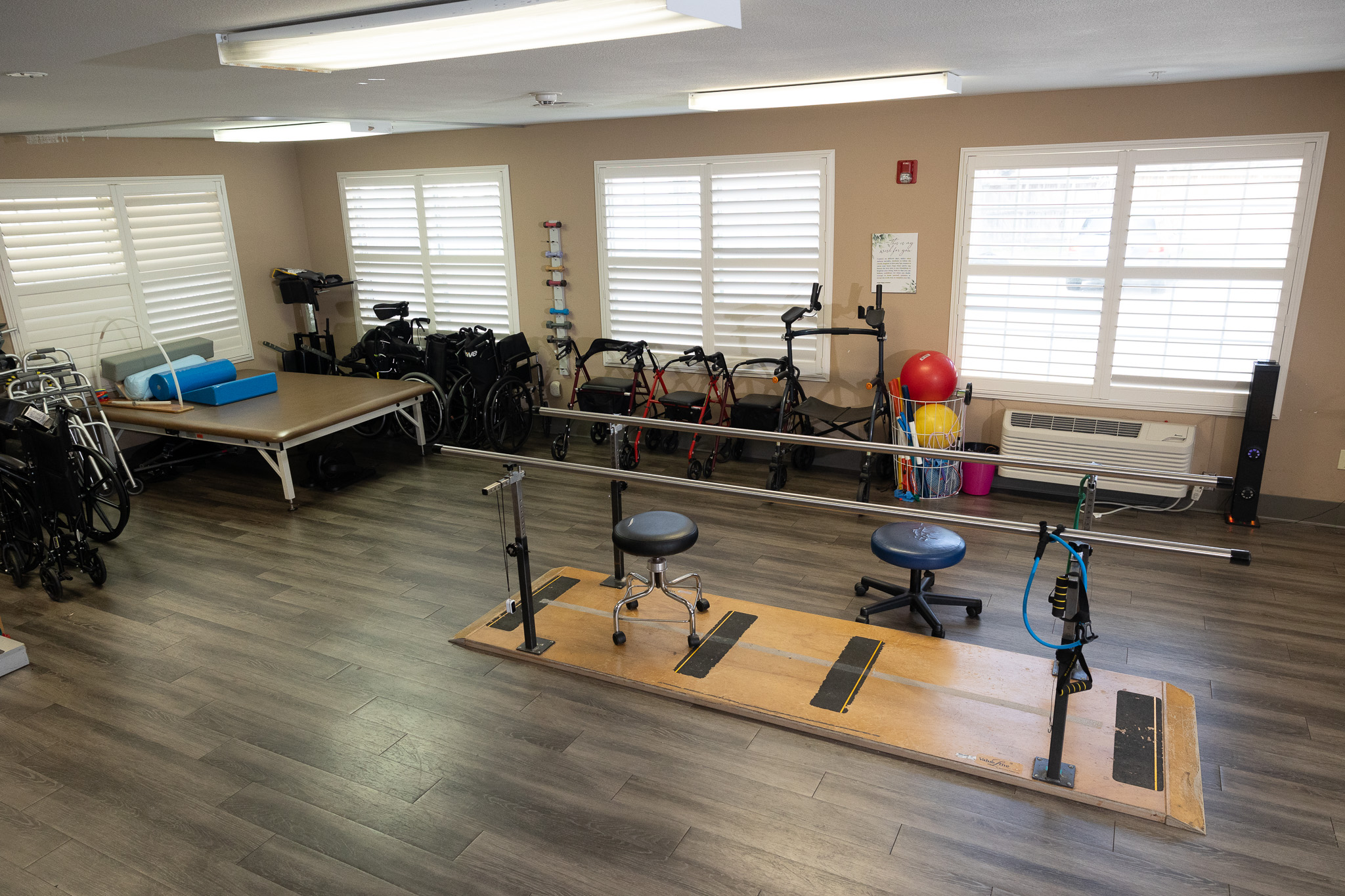 Physical therapy room with equipment and wheels