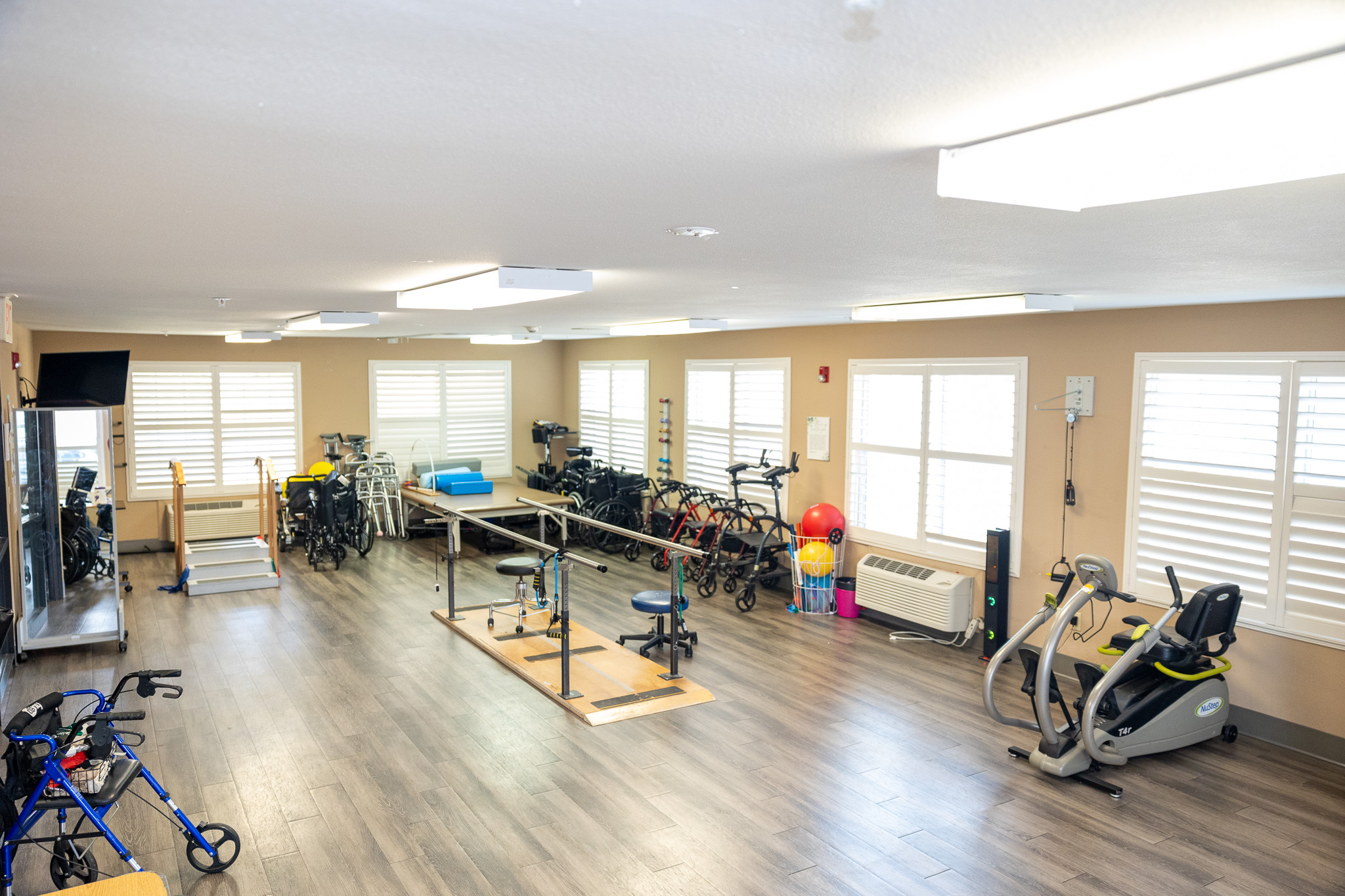 Interior view of a rehabilitation room with exercise equipment