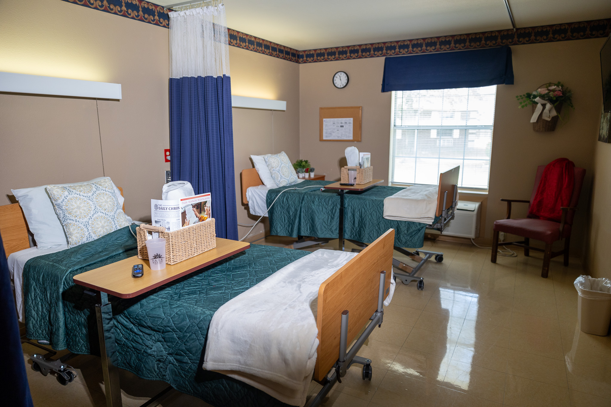 Resident room with two beds and personal items