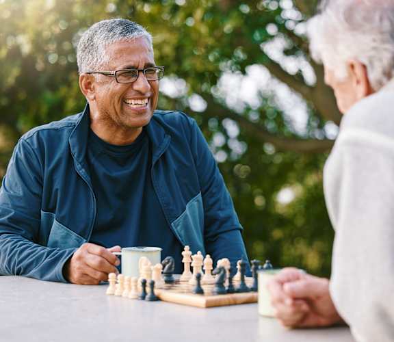Residents enjoying a game of chess outdoors