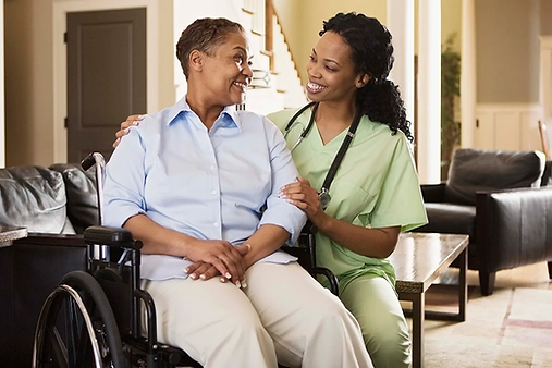 Nurse assisting a resident in a living area.