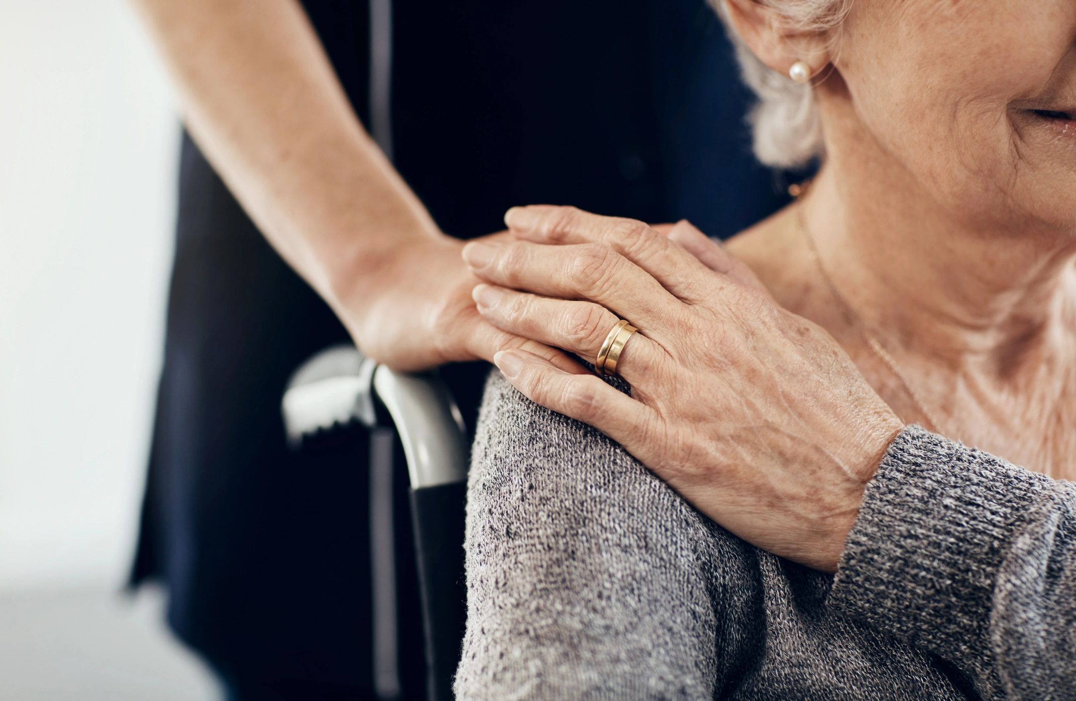 Staff member comforting an elderly resident