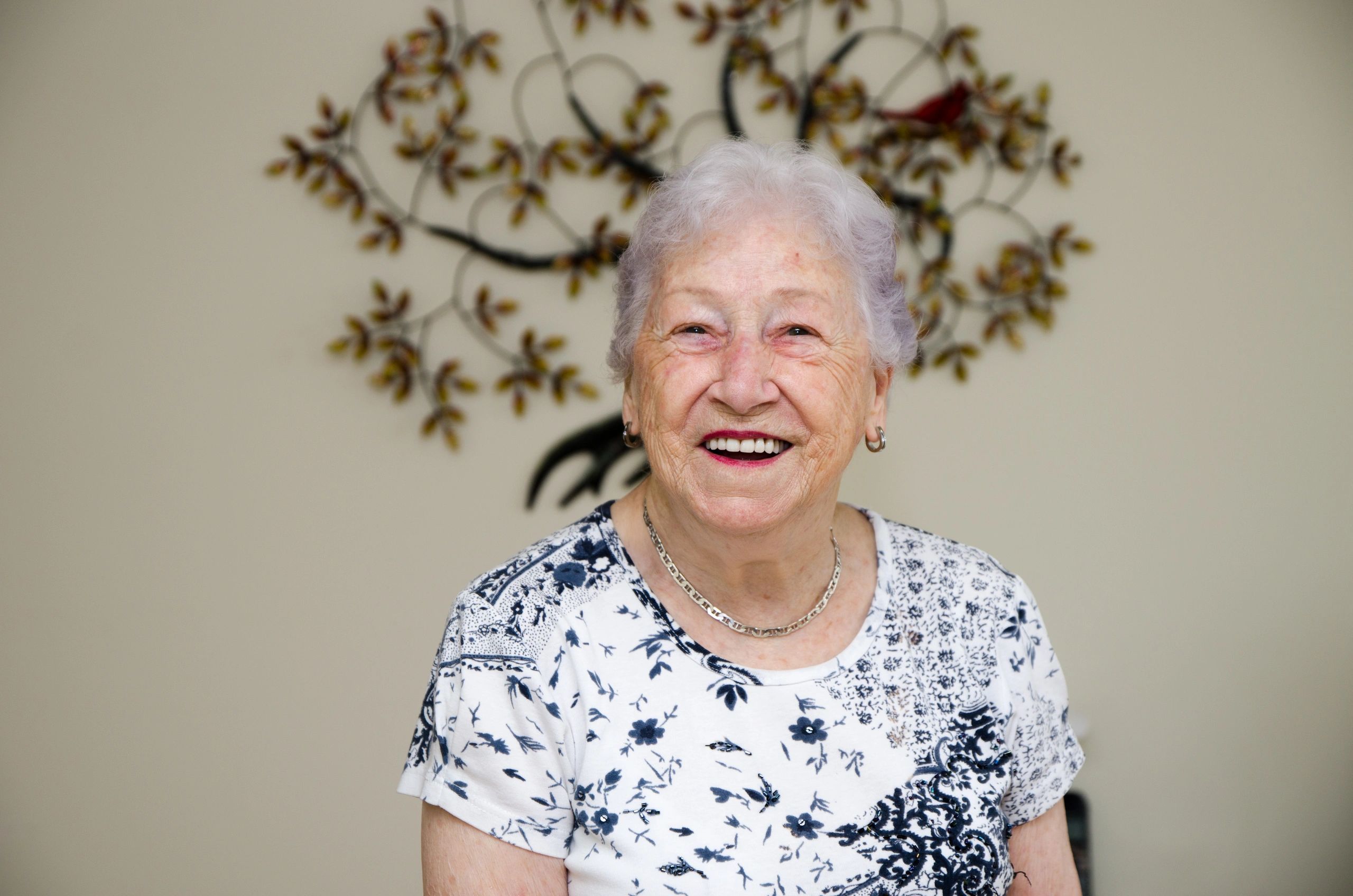 Smiling elderly woman in a living space