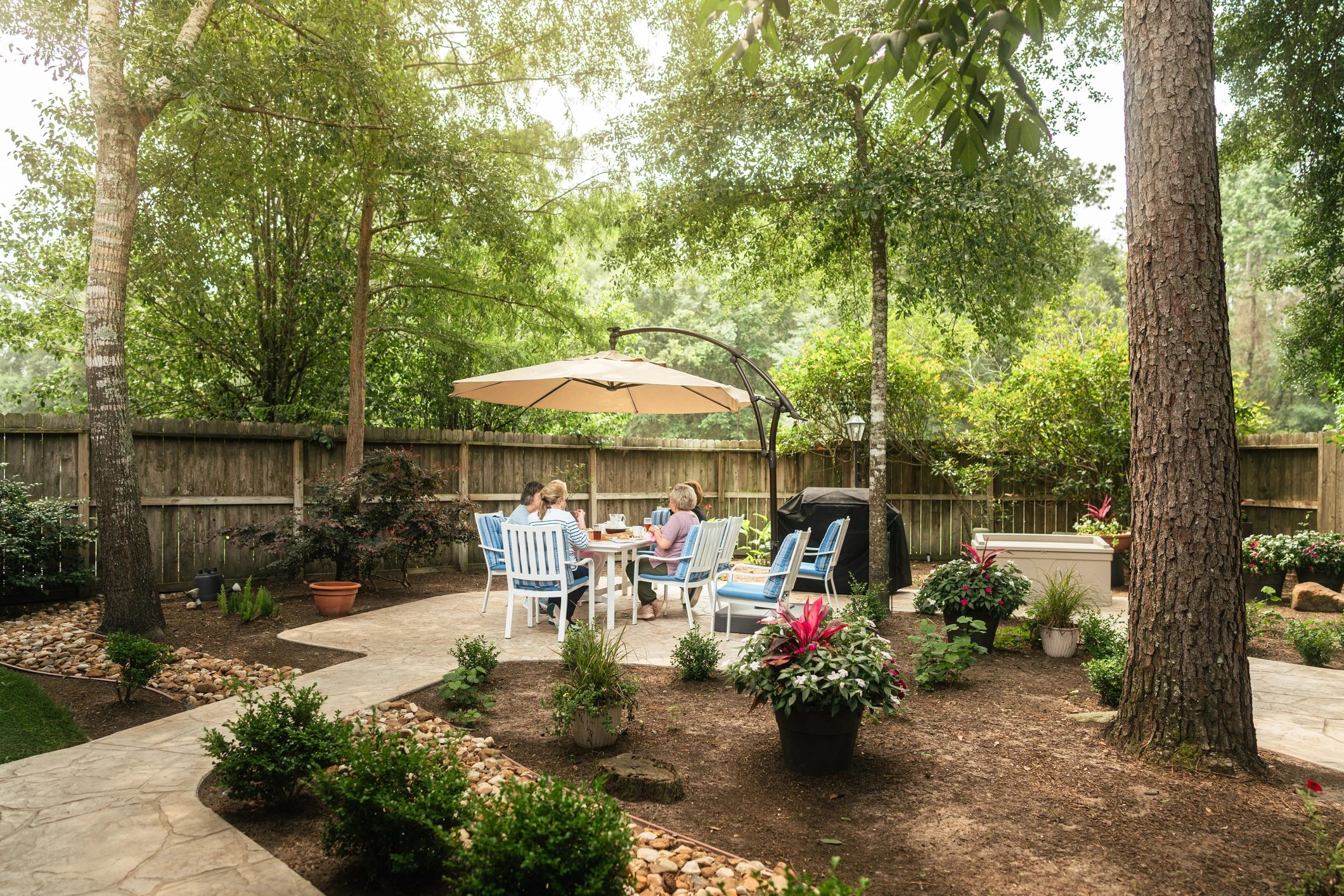 Residents enjoying a meal in a garden area