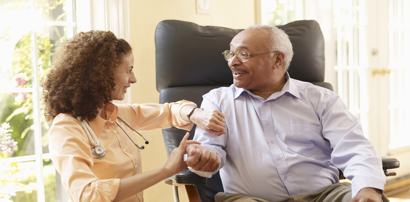 Caregiver interacting with a senior resident