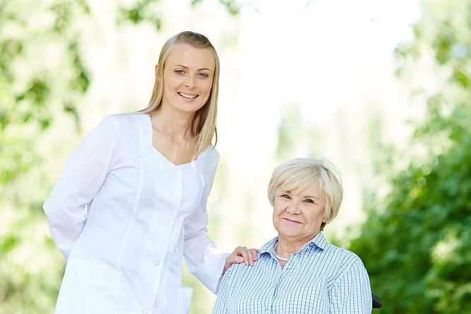 Caregiver with a resident in an outdoor setting