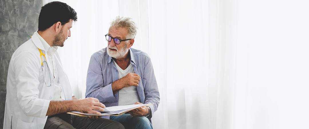 Healthcare professional consulting with an elderly resident.