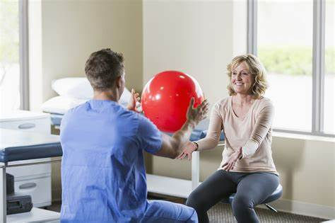 Therapist and resident engaging in exercise.