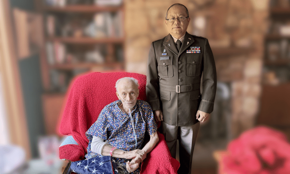 A resident and staff member pose for a photo.