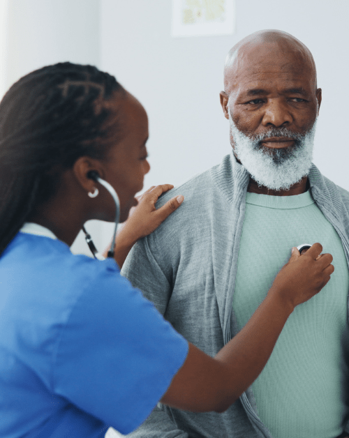 Nurse checking the heartbeat of an older man