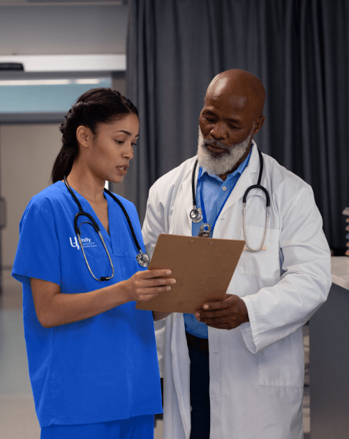 Two healthcare professionals discussing patient care.
