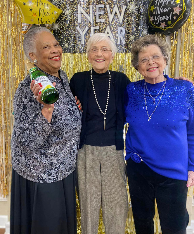 Three residents celebrating New Year together.