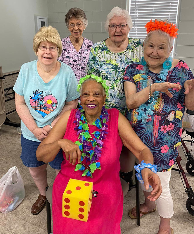 Residents enjoying a cheerful indoor gathering.