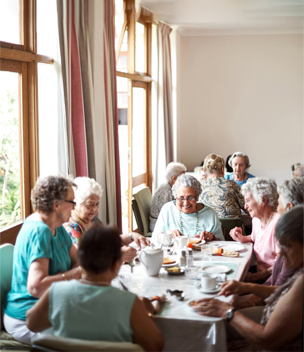 Group of elderly women enjoying a meal together