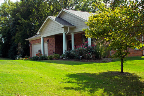 Exterior view of a residential building with landscaping