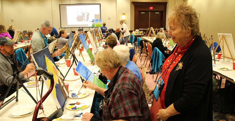 Residents engaged in a painting activity